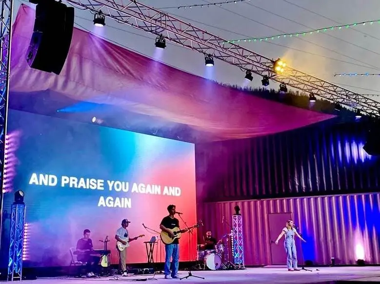 Large-format LED video wall lighting up a live worship stage with vivid color, installed by Inland AV Solutions